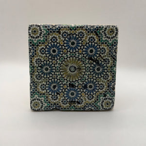 Ethnics pattern number 33 printed on a natural travertine stone coaster