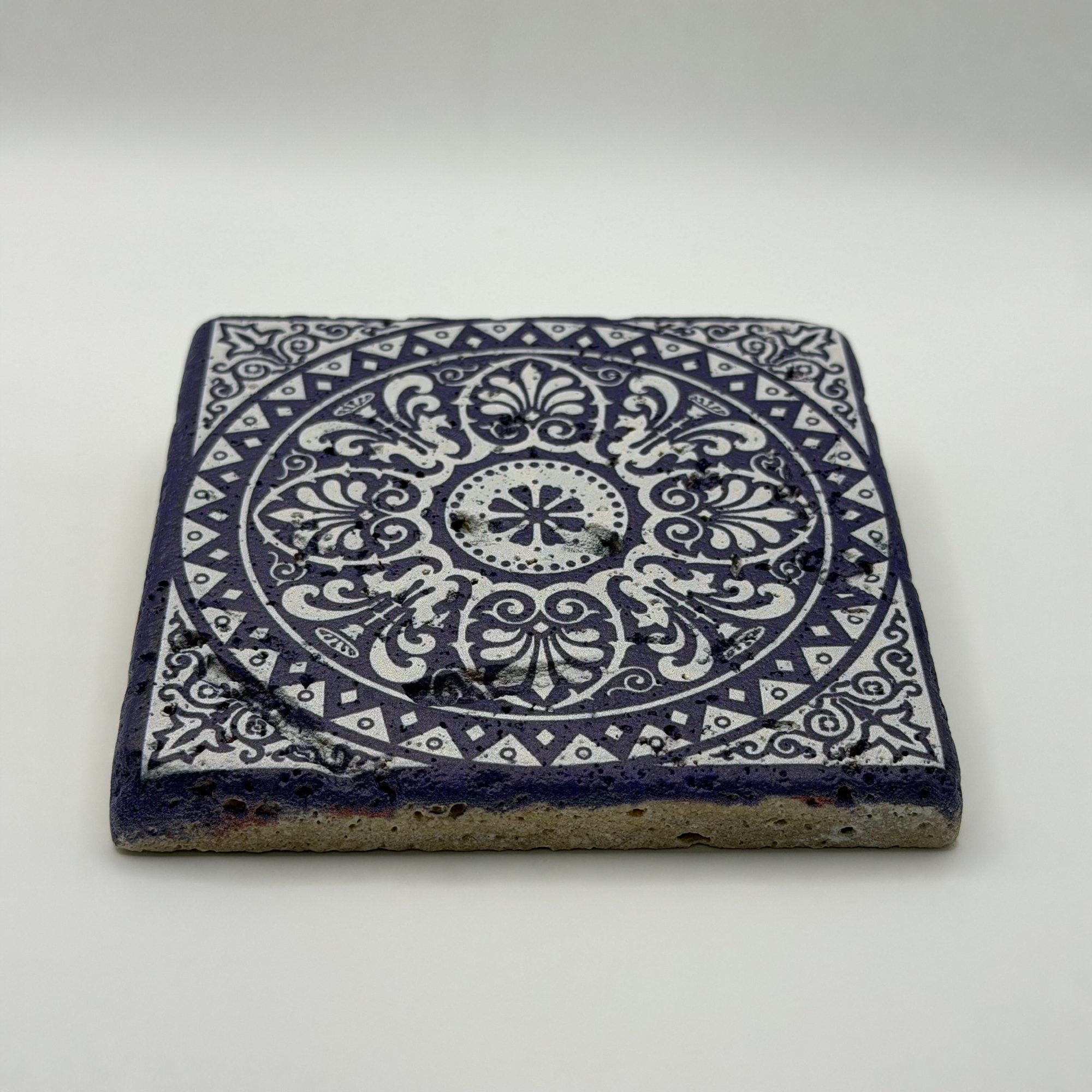 Ethnics pattern number 34 printed on a natural travertine stone coaster