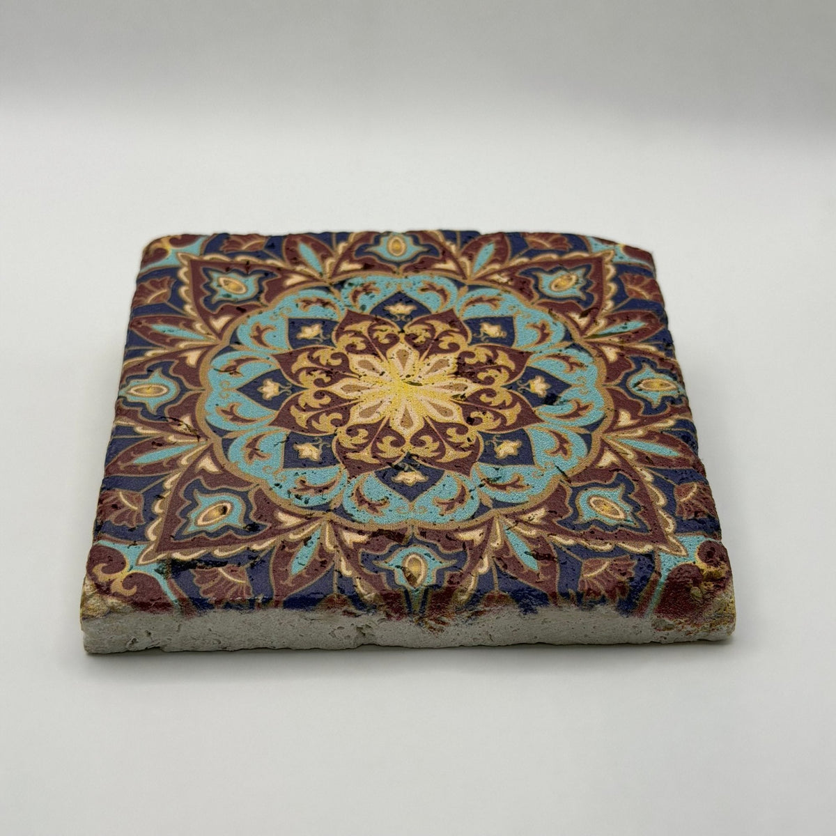 Ethnics pattern number 35 printed on a natural travertine stone coaster