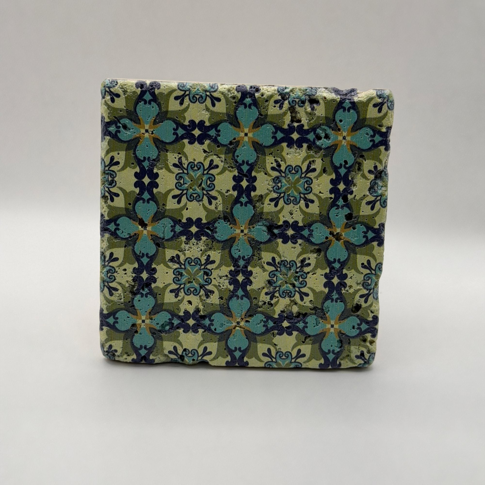 Ethnics pattern number 36 printed on a natural travertine stone coaster
