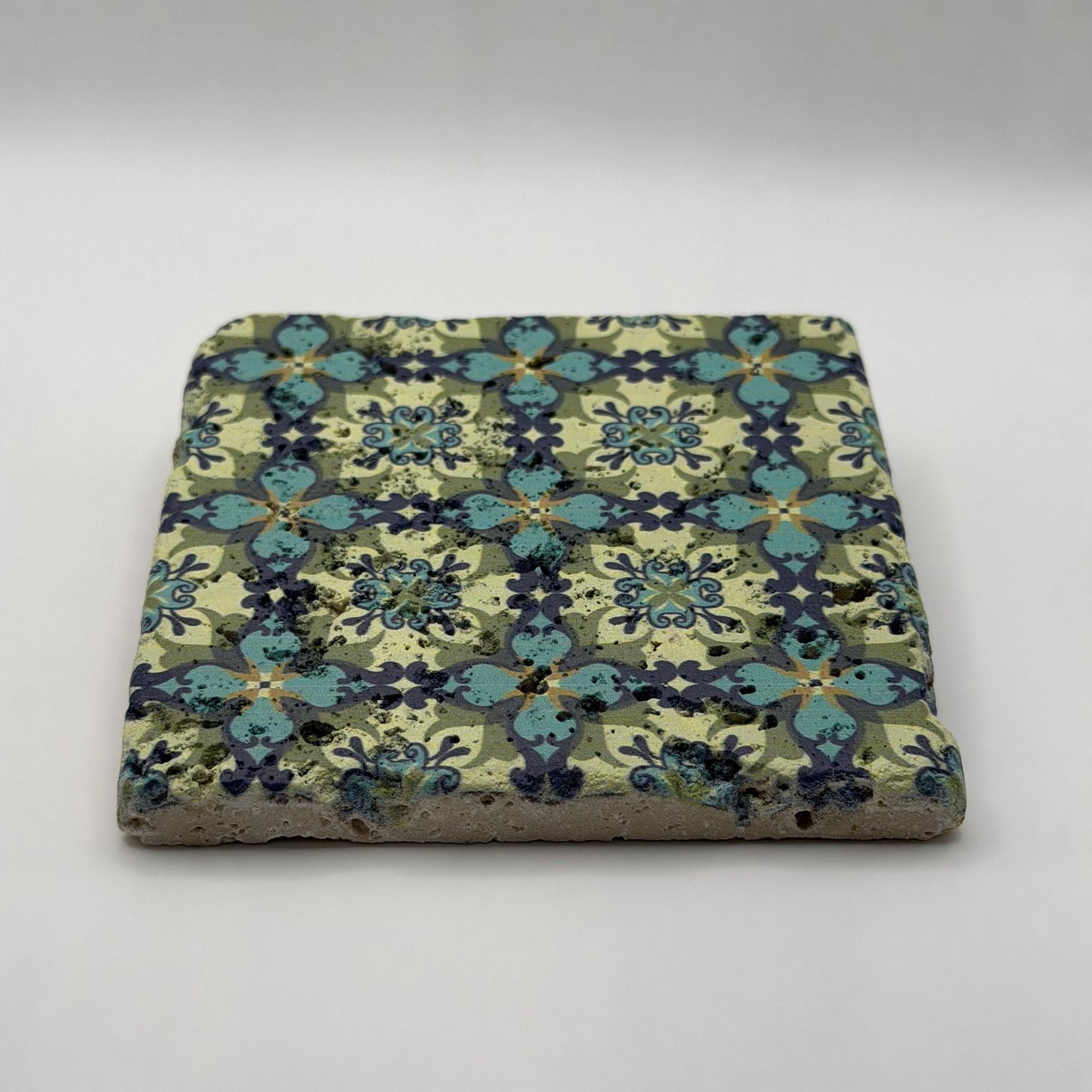 Ethnics pattern number 36 printed on a natural travertine stone coaster