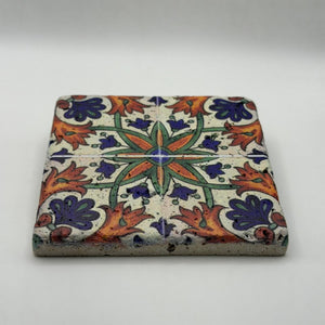 Ethnics pattern number 37 printed on a natural travertine stone coaster