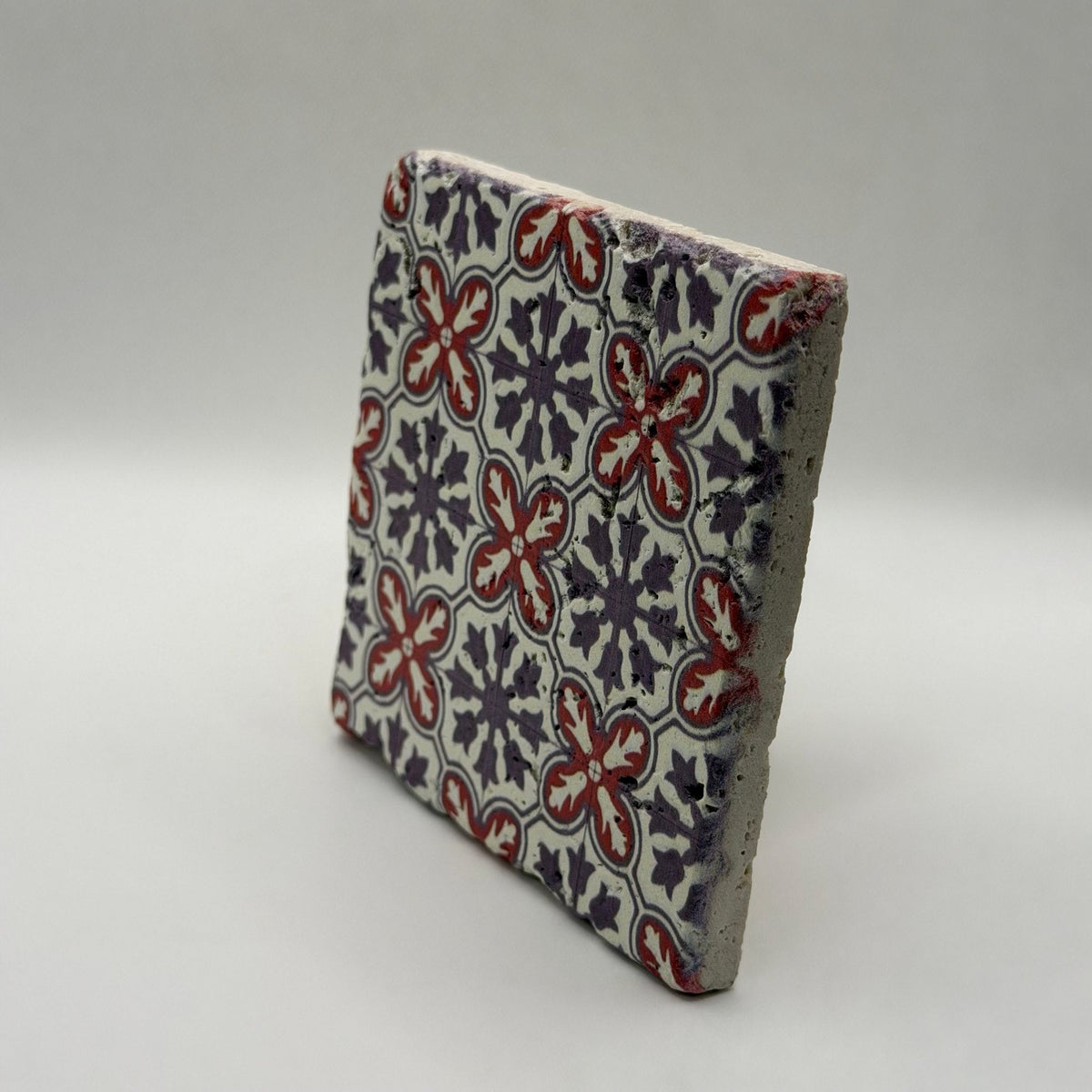 Ethnics pattern number 39 printed on a natural travertine stone coaster