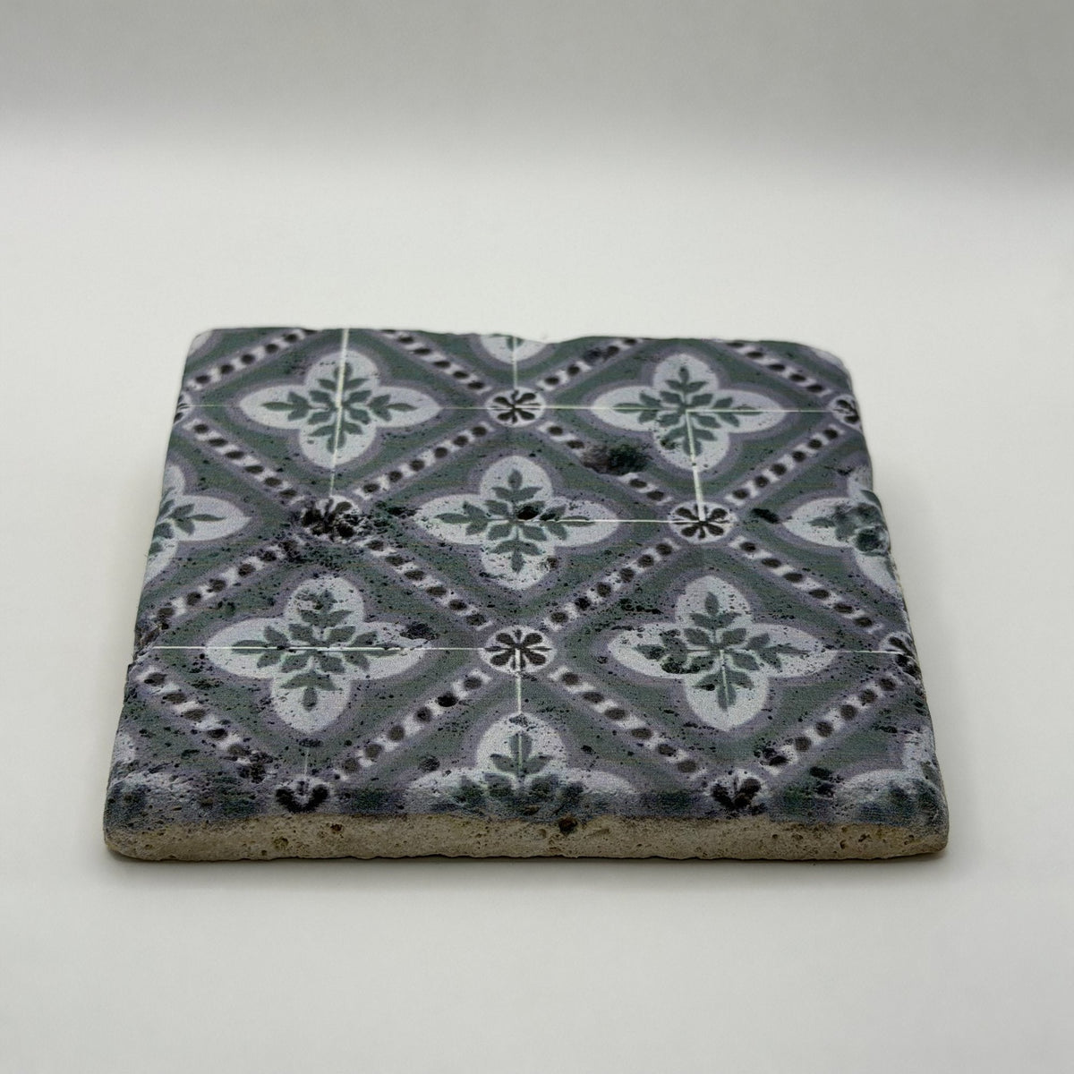 Ethnics pattern number 40 printed on a natural travertine stone coaster