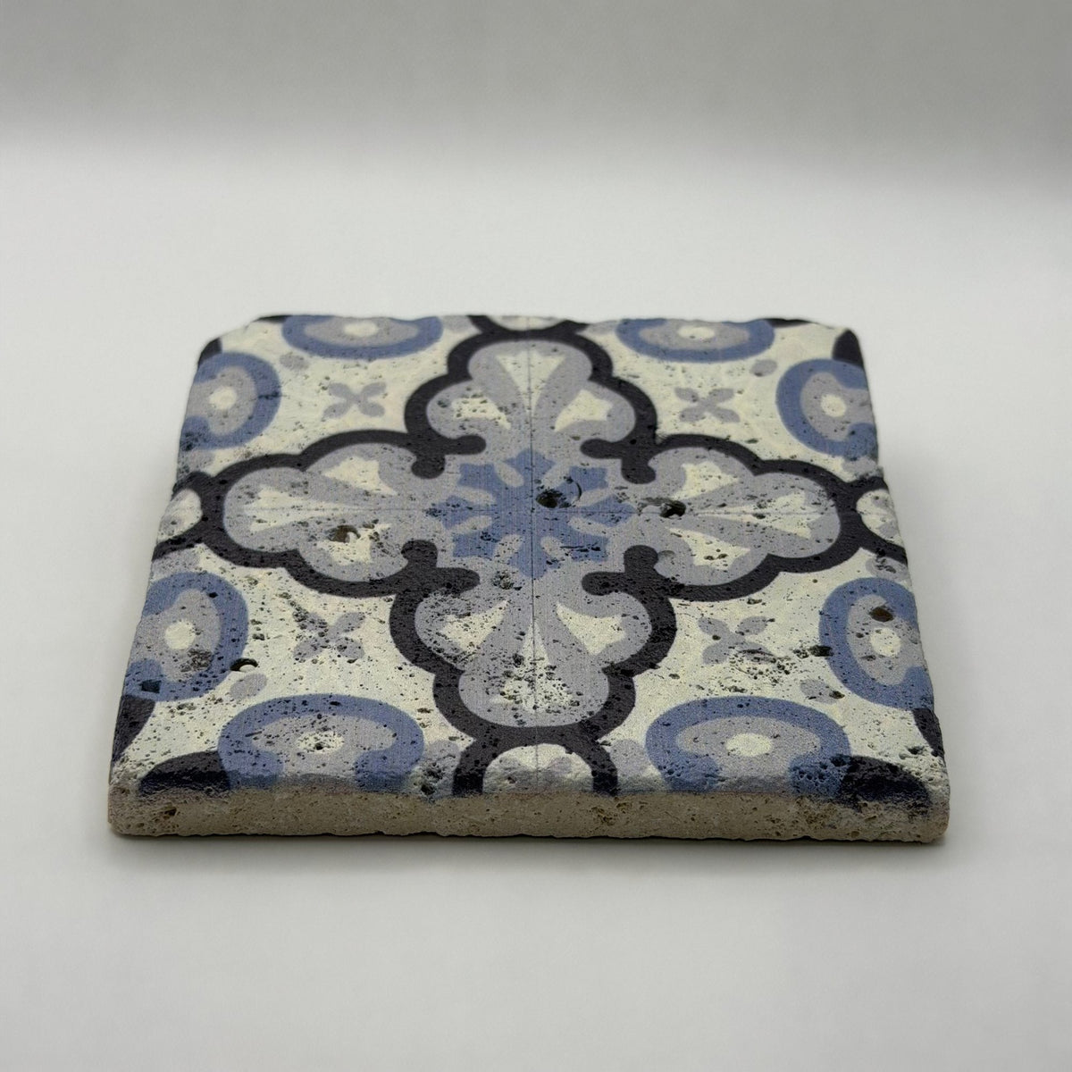 Ethnics pattern number 43 printed on a natural travertine stone coaster