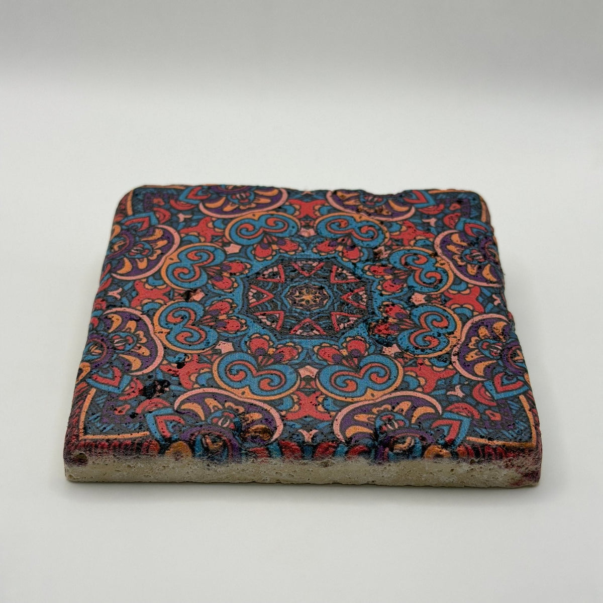 Ethnics pattern number 45 printed on a natural travertine stone coaster