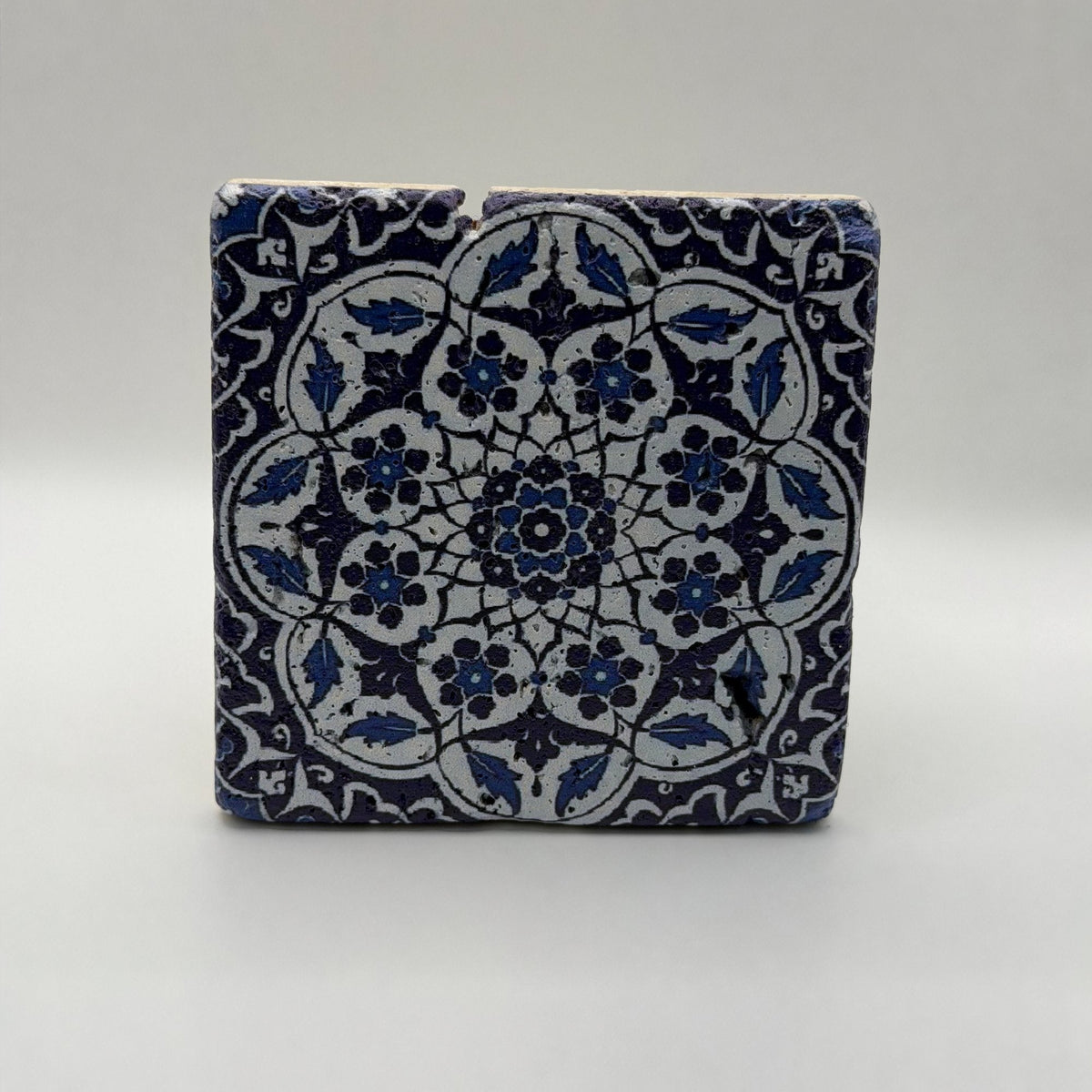 Ethnics pattern number 48 printed on a natural travertine stone coaster