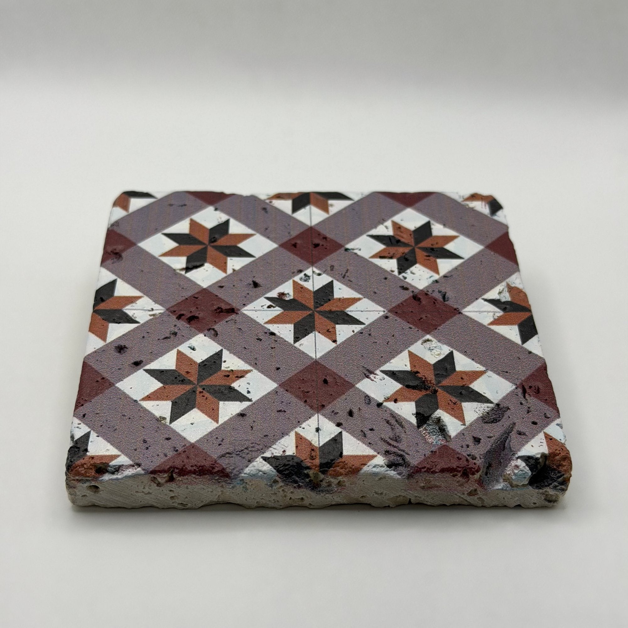 Ethnics pattern number 49 printed on a natural travertine stone coaster