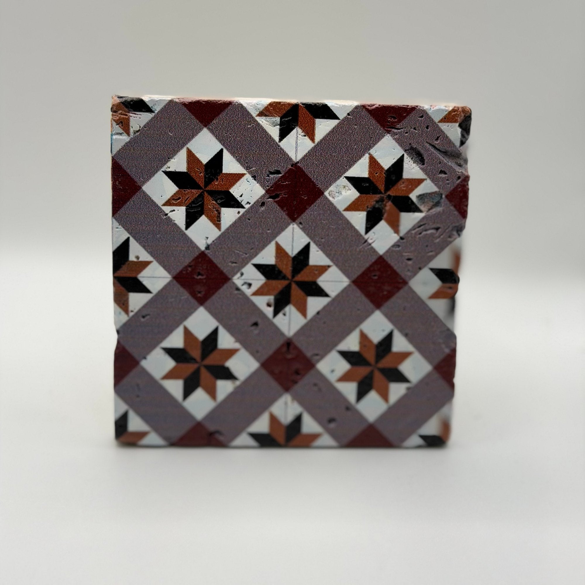 Ethnics pattern number 49 printed on a natural travertine stone coaster