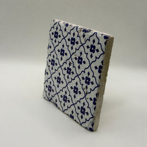 Ethnics pattern number 51 printed on a natural travertine stone coaster