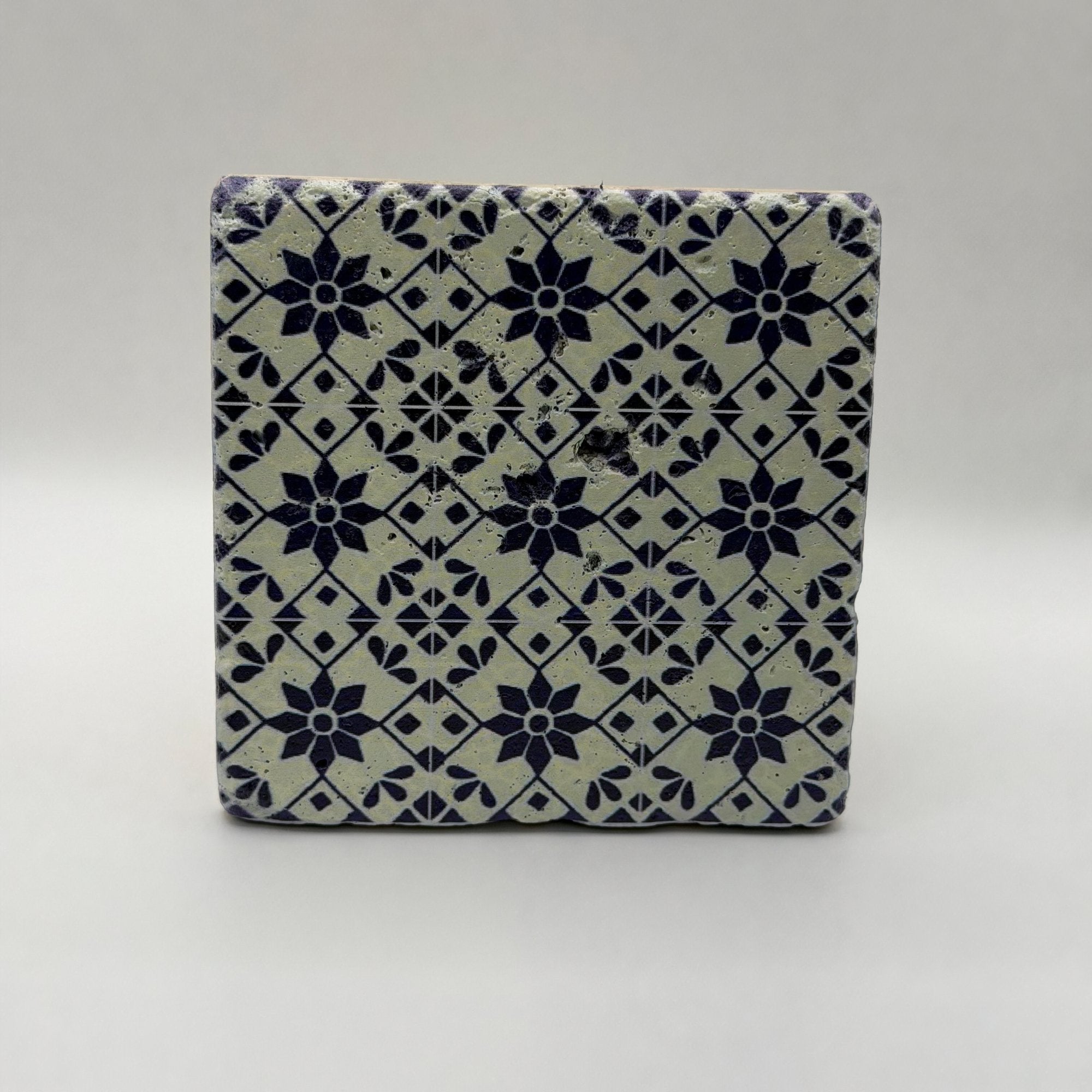 Ethnics pattern number 53 printed on a natural travertine stone coaster