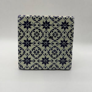 Ethnics pattern number 53 printed on a natural travertine stone coaster
