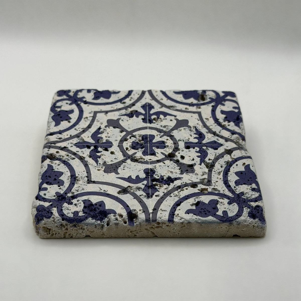 Ethnics pattern number 54 printed on a natural travertine stone coaster