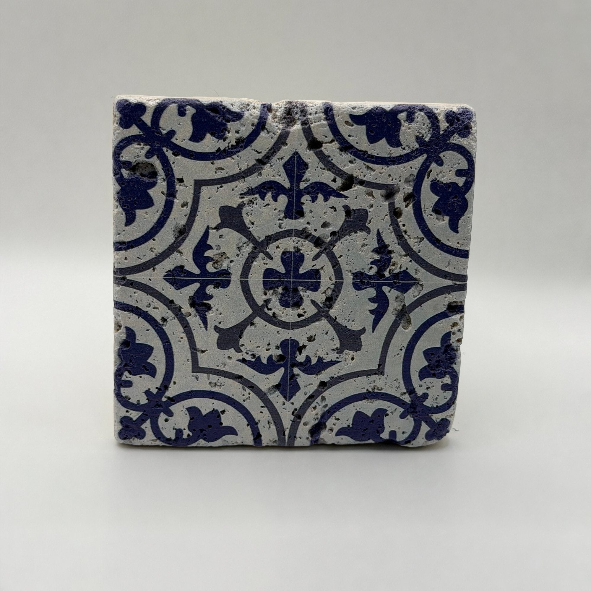 Ethnics pattern number 54 printed on a natural travertine stone coaster