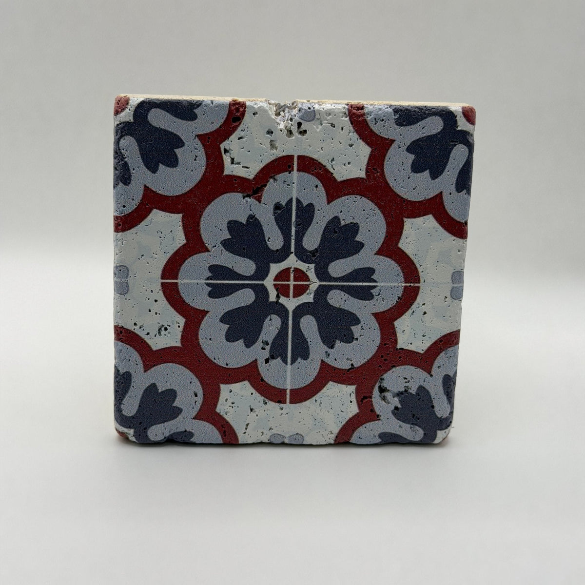 Ethnics pattern number 55 printed on a natural travertine stone coaster