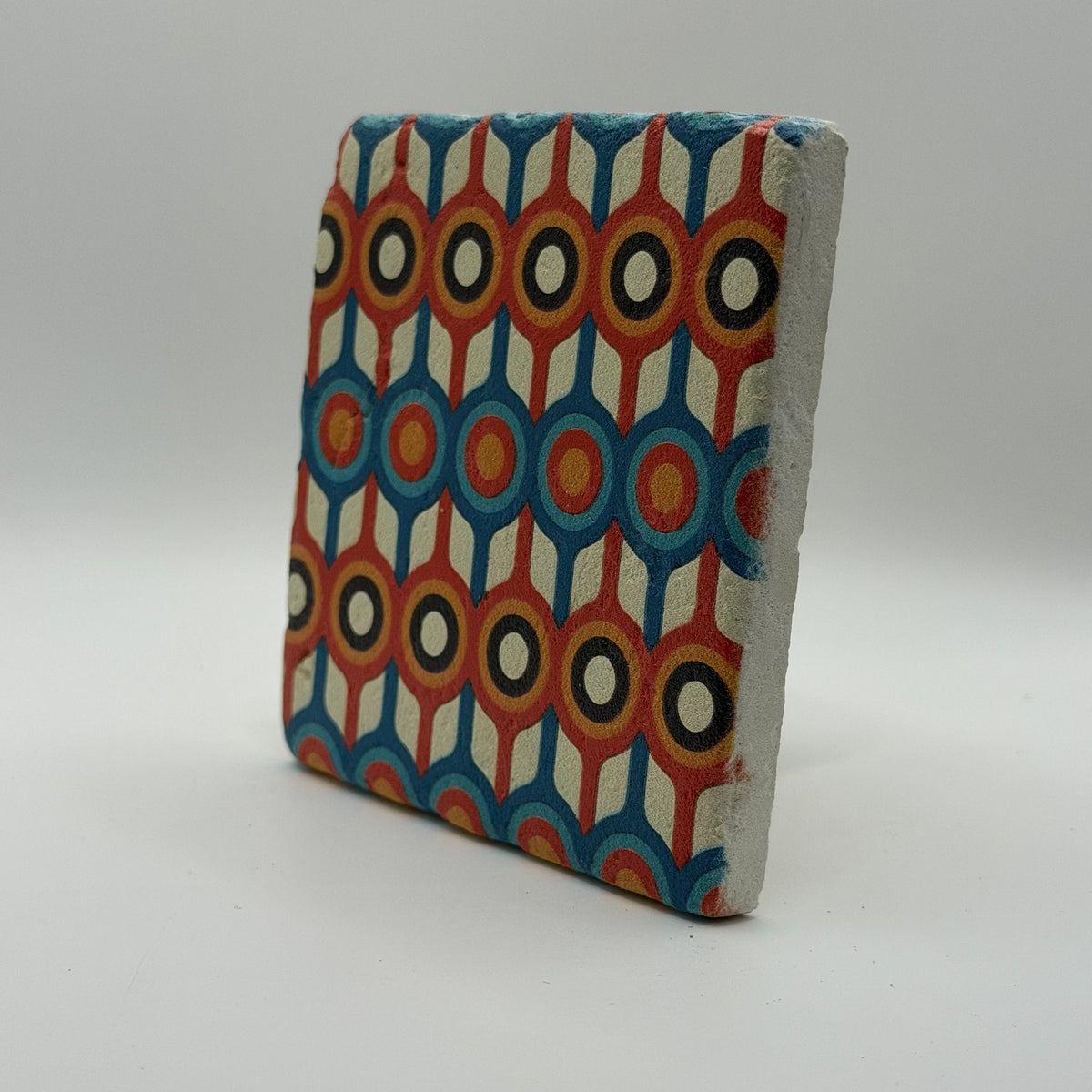 Ethnics pattern number 58 printed on a natural travertine stone coaster