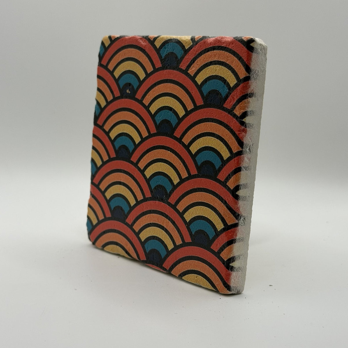 Ethnics pattern number 59 printed on a natural travertine stone coaster