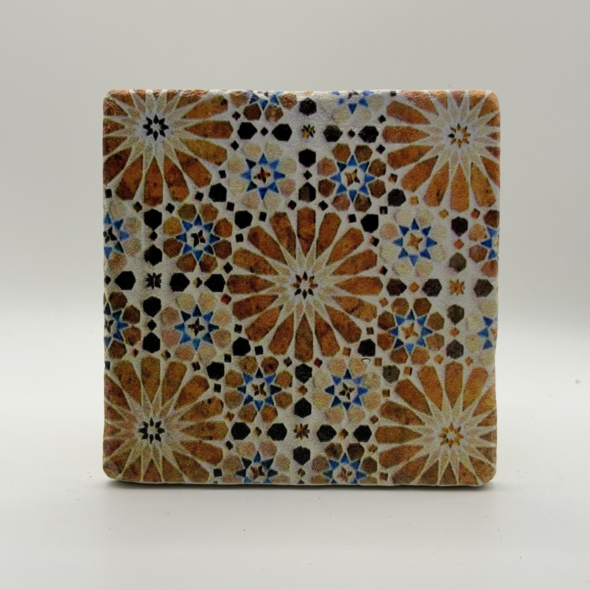 Ethnics pattern number 61 printed on a natural travertine stone coaster