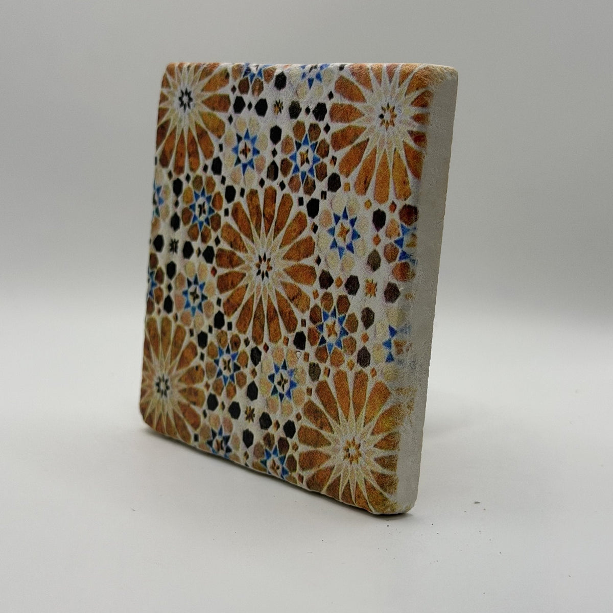 Ethnics pattern number 61 printed on a natural travertine stone coaster