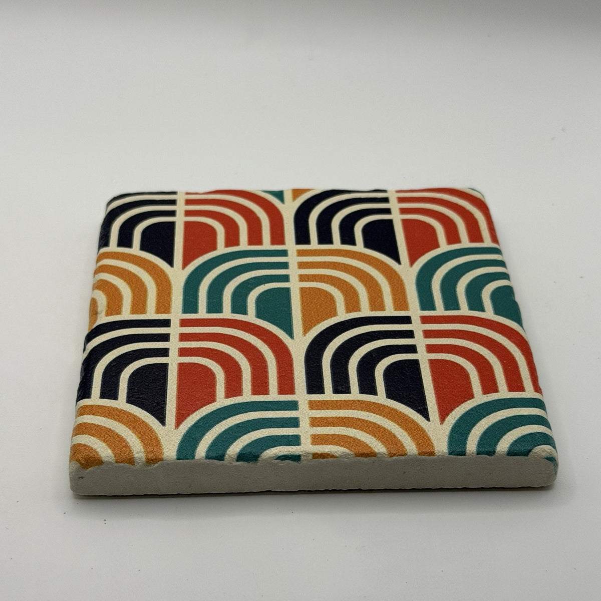 Ethnics pattern number 62 printed on a natural travertine stone coaster
