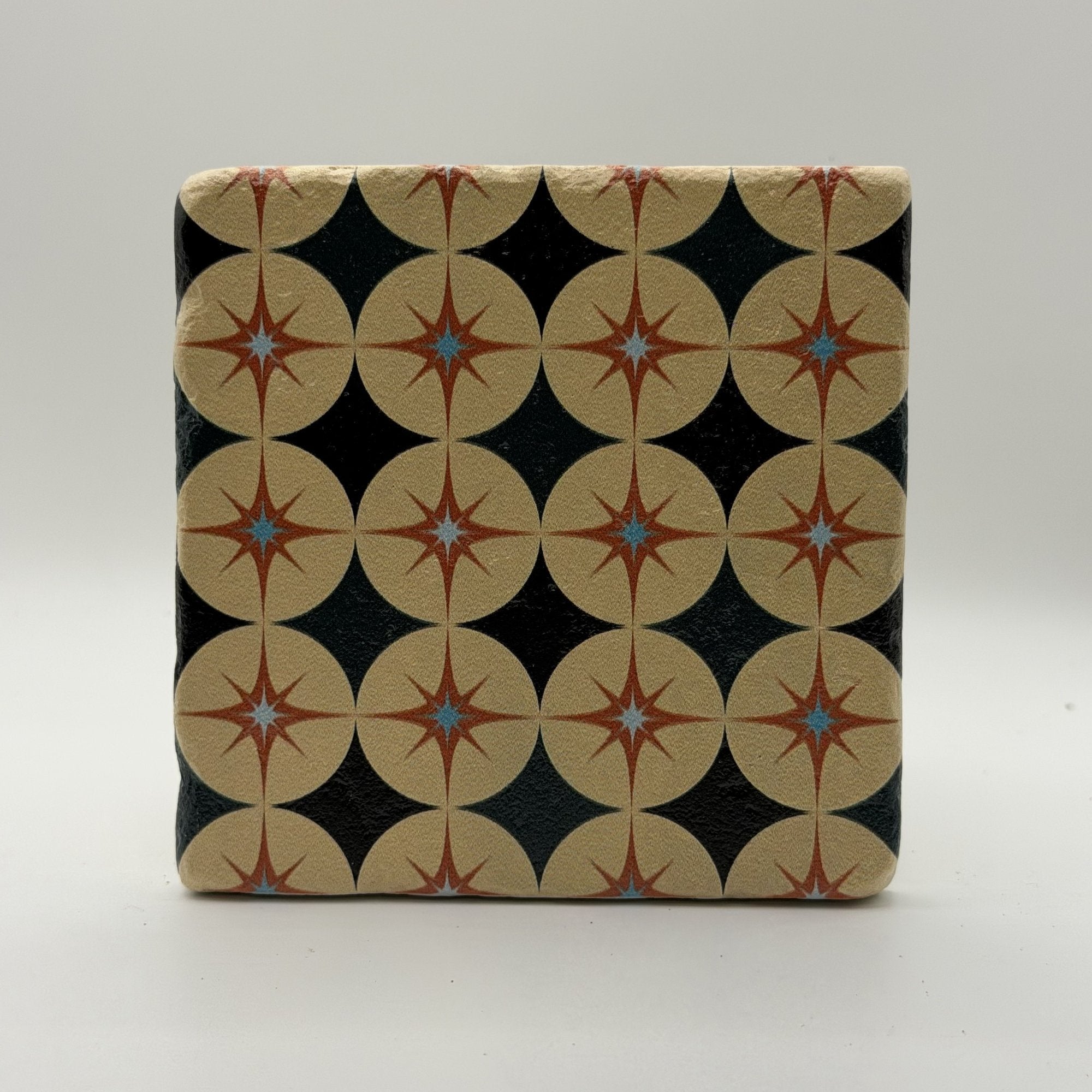 Ethnics pattern number 63 printed on a natural travertine stone coaster