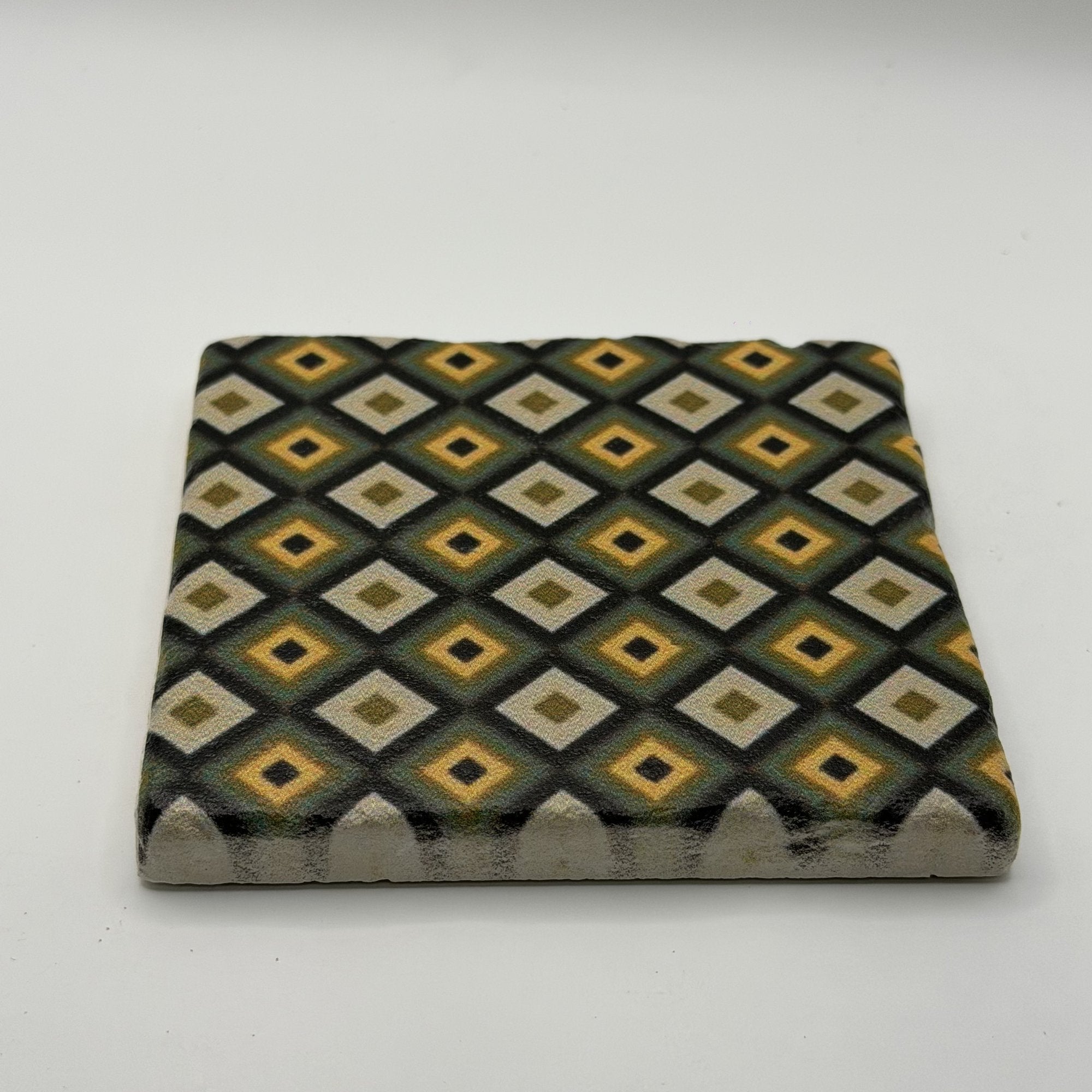 Ethnics pattern number 64 printed on a natural travertine stone coaster