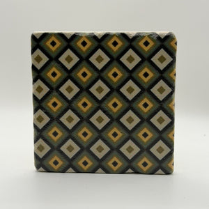 Ethnics pattern number 64 printed on a natural travertine stone coaster