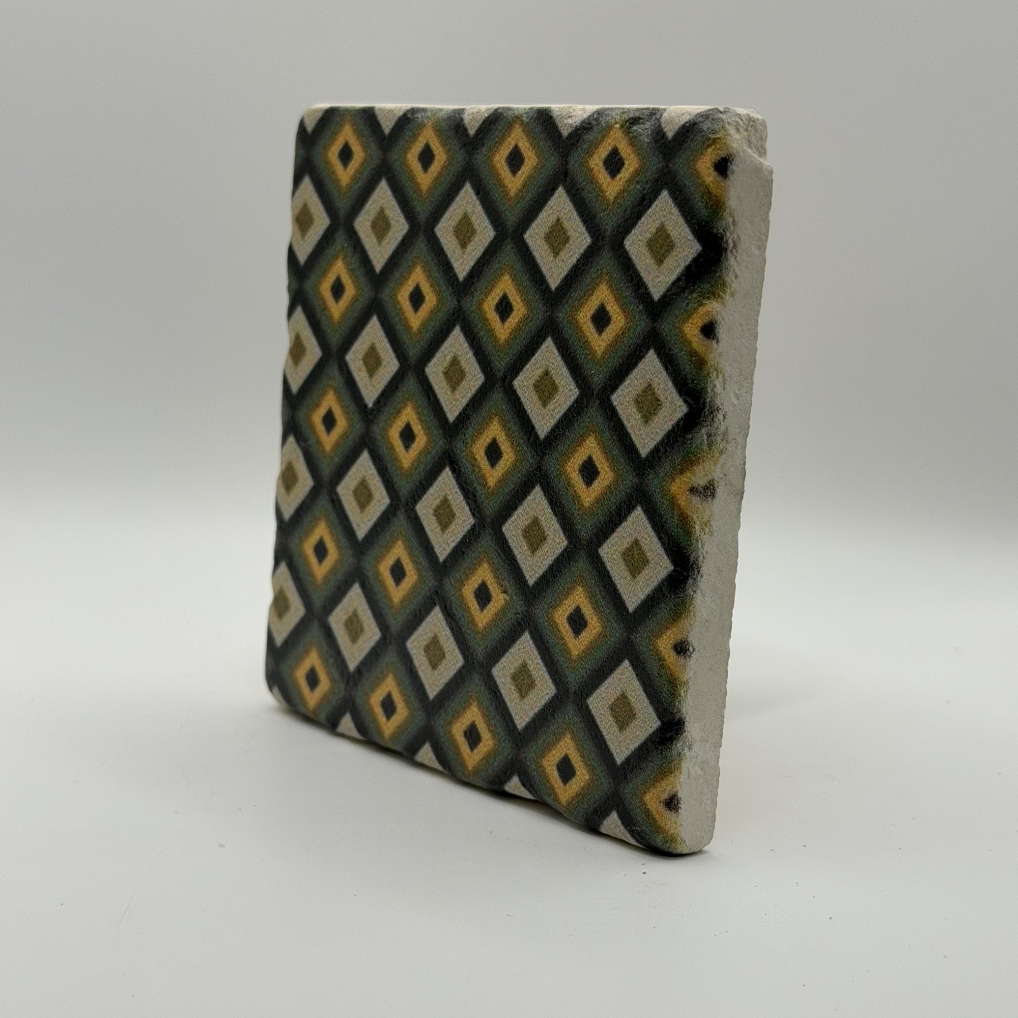 Ethnics pattern number 64 printed on a natural travertine stone coaster