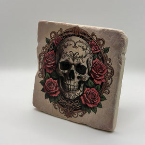 Grungy skull artwork surrounded by roses printed on square travertine stone coaster