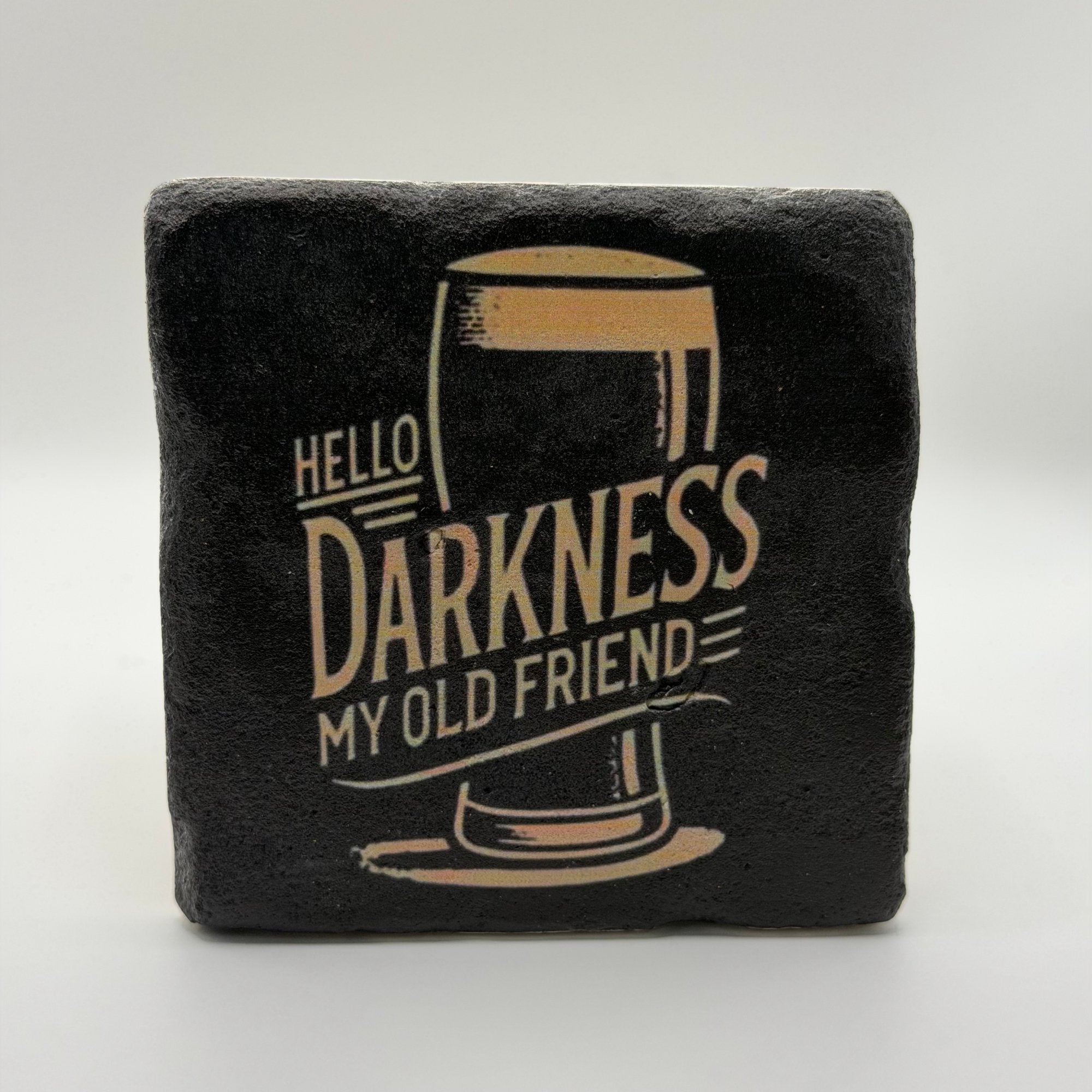 Slogan 'Hello Darkness My Old Friend' printed on square travertine stone coaster