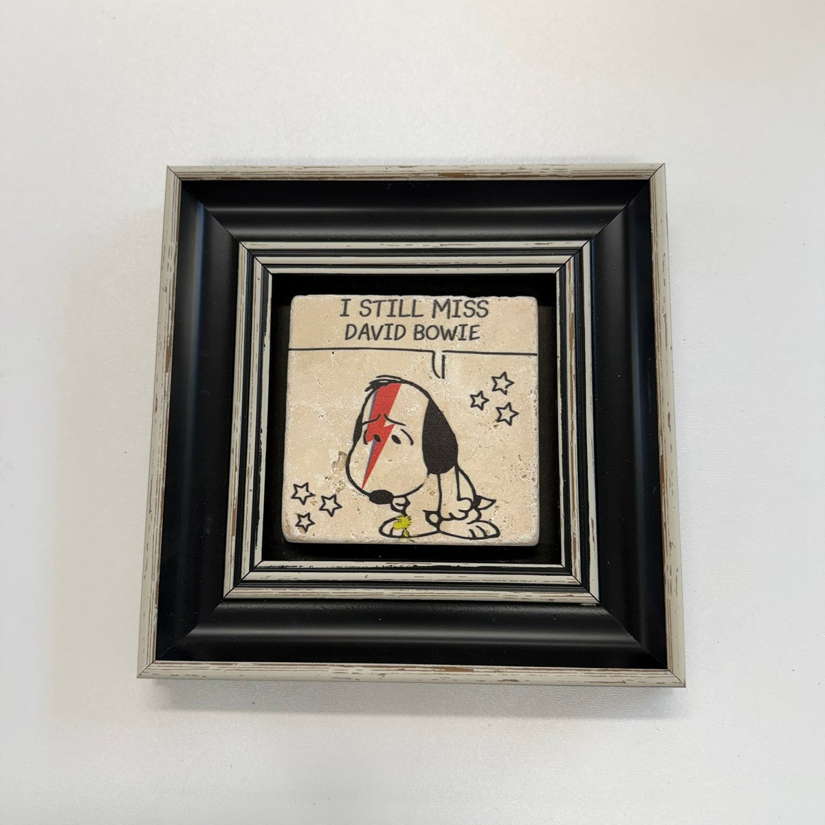 Variant Mapping v4 | i-still-miss-david-bowie-natural-travertine-coaster | with Black Frame | sha256:5ab3a4d4fa75