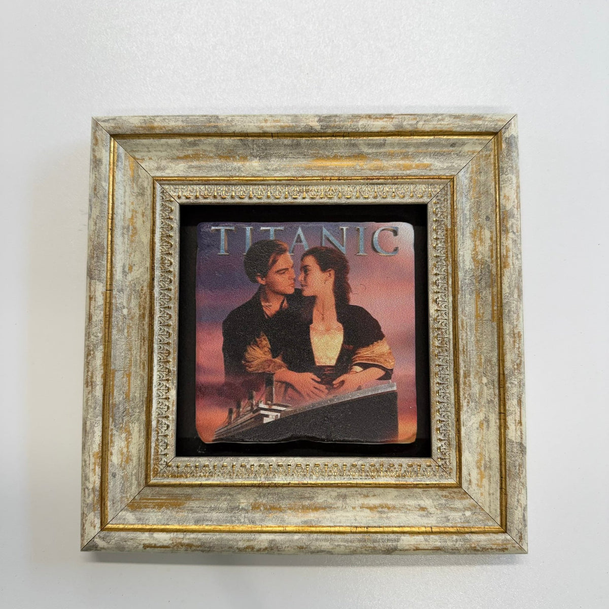 Variant Mapping v4 | james-cameron-titanic-natural-stone-coaster | with Gold Frame | sha256:5845662e9fc5