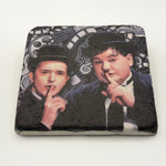 Vintage artwork of Laurel and Hardy printed on square travertine stone coaster