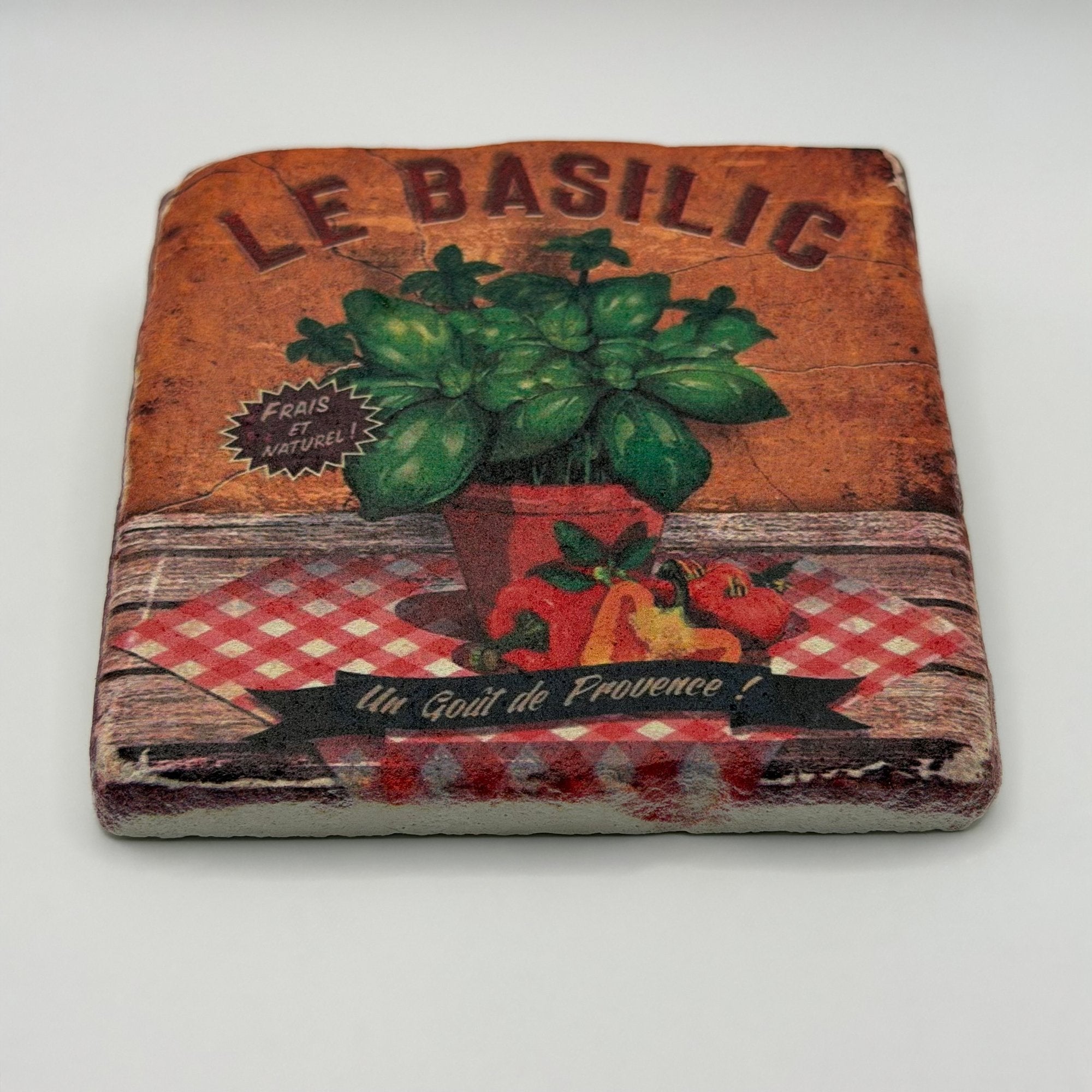 Le Basilic recipe artwork printed on square travertine stone coaster