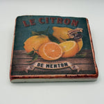 A lemon illustration printed on square travertine stone coaster