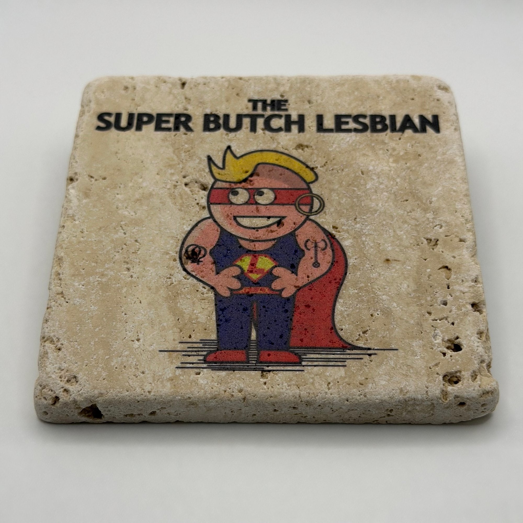 Little Miss artwork featuring The Super Butch Lesbian printed on square travertine stone coaster
