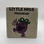 Cartoon Little Miss Pisshead printed on square natural travertine stone coaster