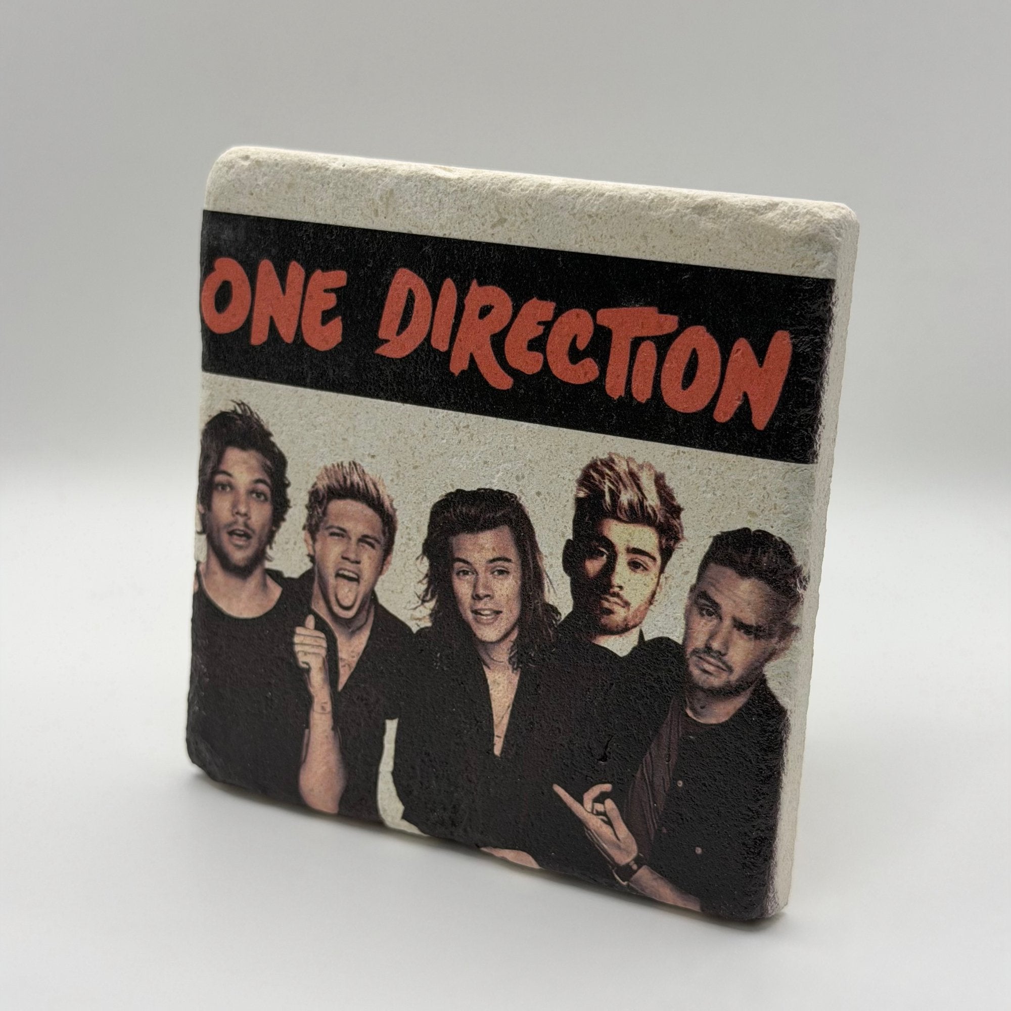 One Direction artwork printed on square travertine stone coaster