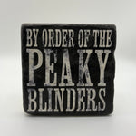 By Order of the Peaky Blinders slogan printed on square travertine stone coaster