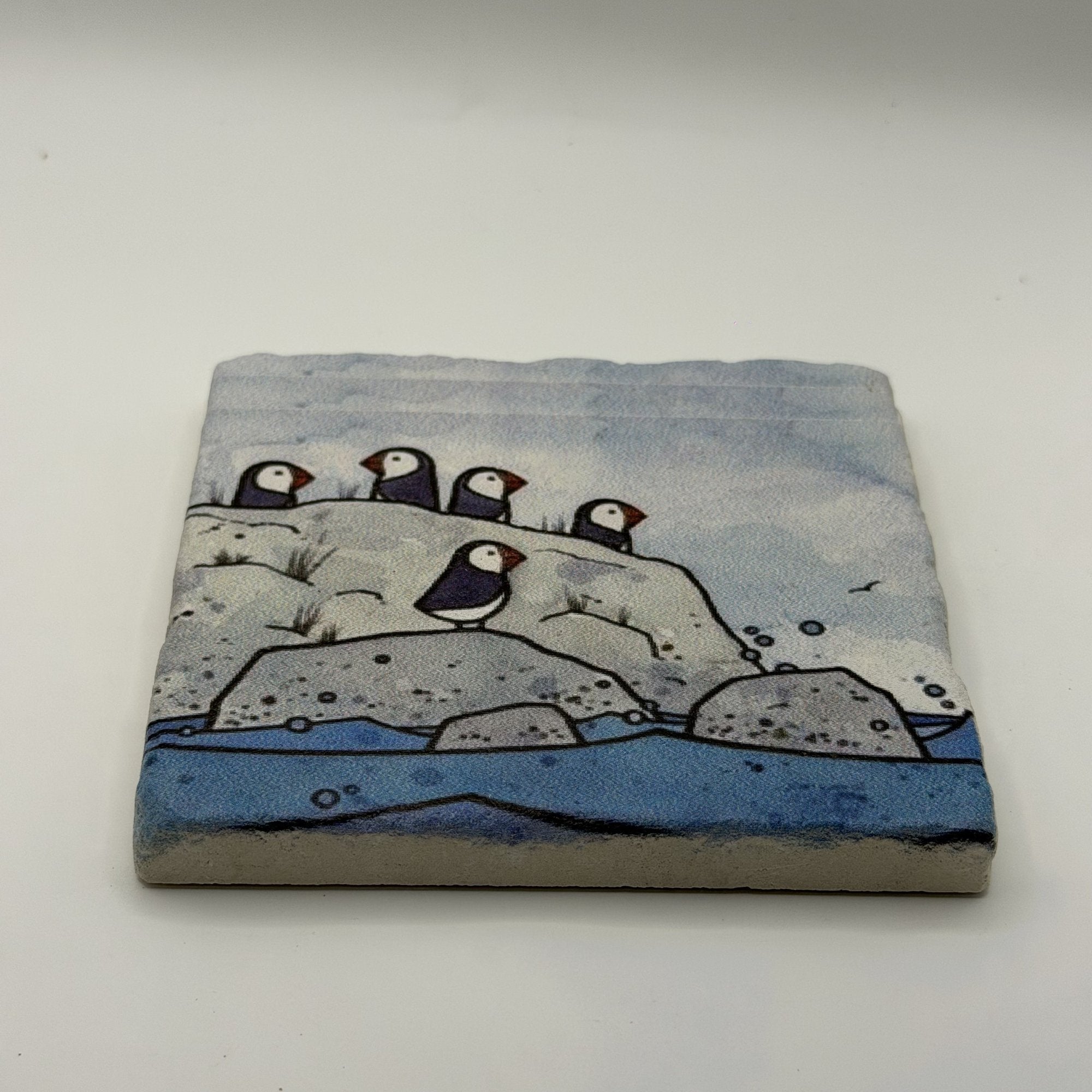 Penguins Natural Travertine Stone Coaster artwork