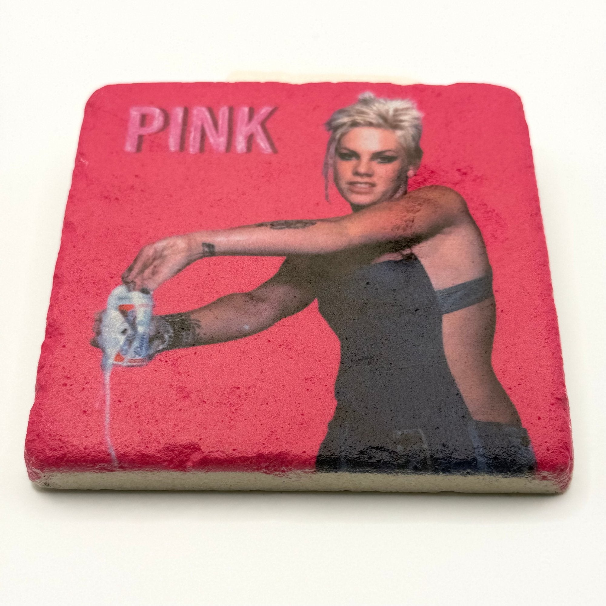 Pink Funhouse artwork printed on square travertine stone coaster