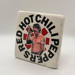 Red Hot Chili Peppers artwork printed on square travertine stone coaster
