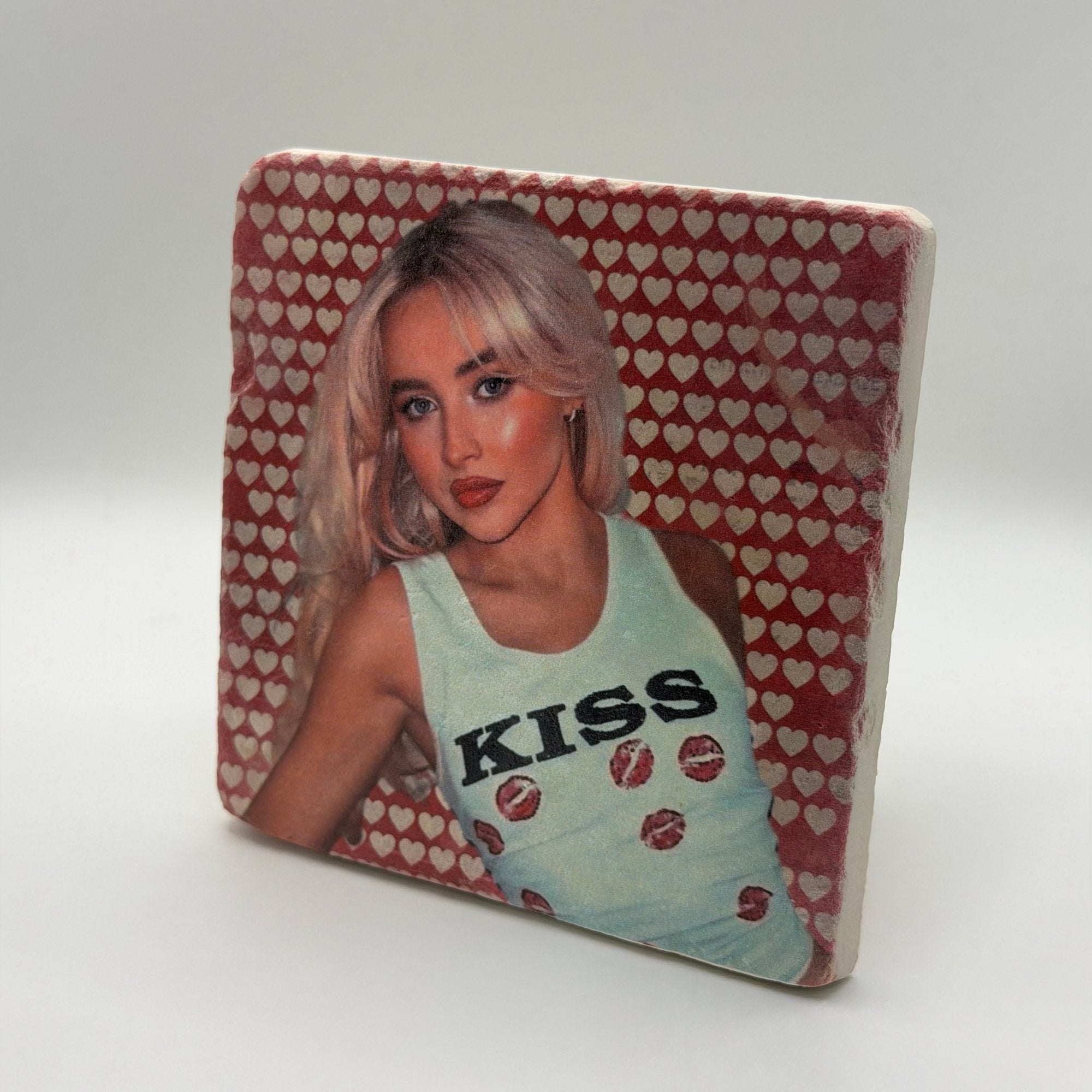 Sabrina Carpenter kiss artwork printed on square travertine stone coaster