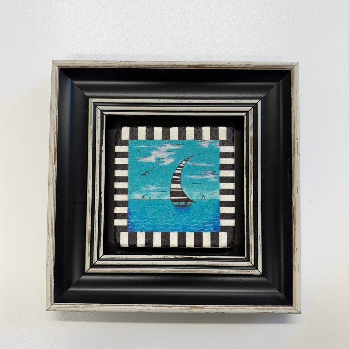 Variant Mapping v4 | sailboat-natural-travertine-stone-coaster | with Black Frame | sha256:45daf1e4324f