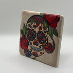 Sugar skull artwork printed on square travertine stone coaster