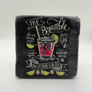 The Bramble artwork printed on square travertine stone coaster