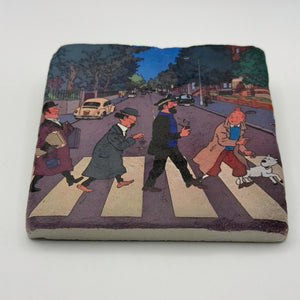 Tintin artwork featuring the Beatles' Abbey Road print on square travertine stone coaster