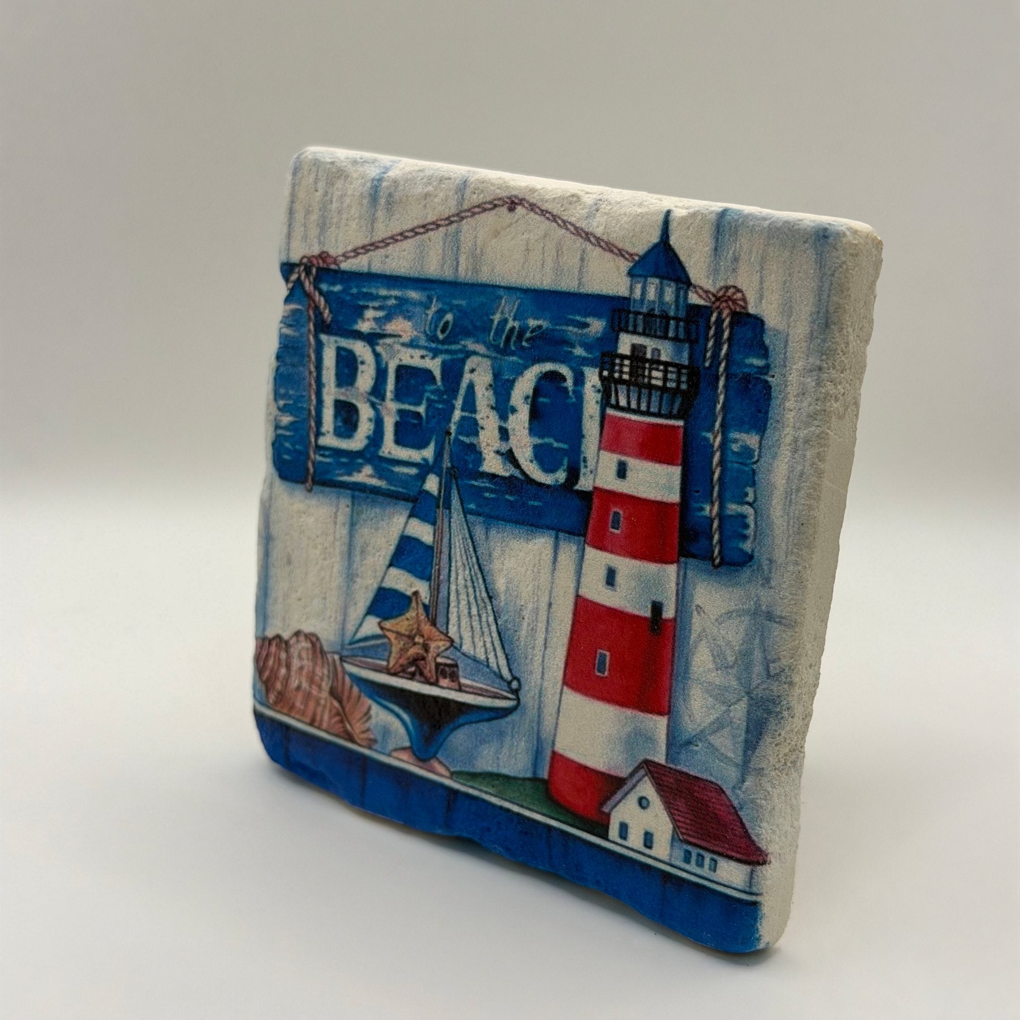 Coastal themed artwork printed on square natural travertine stone coaster