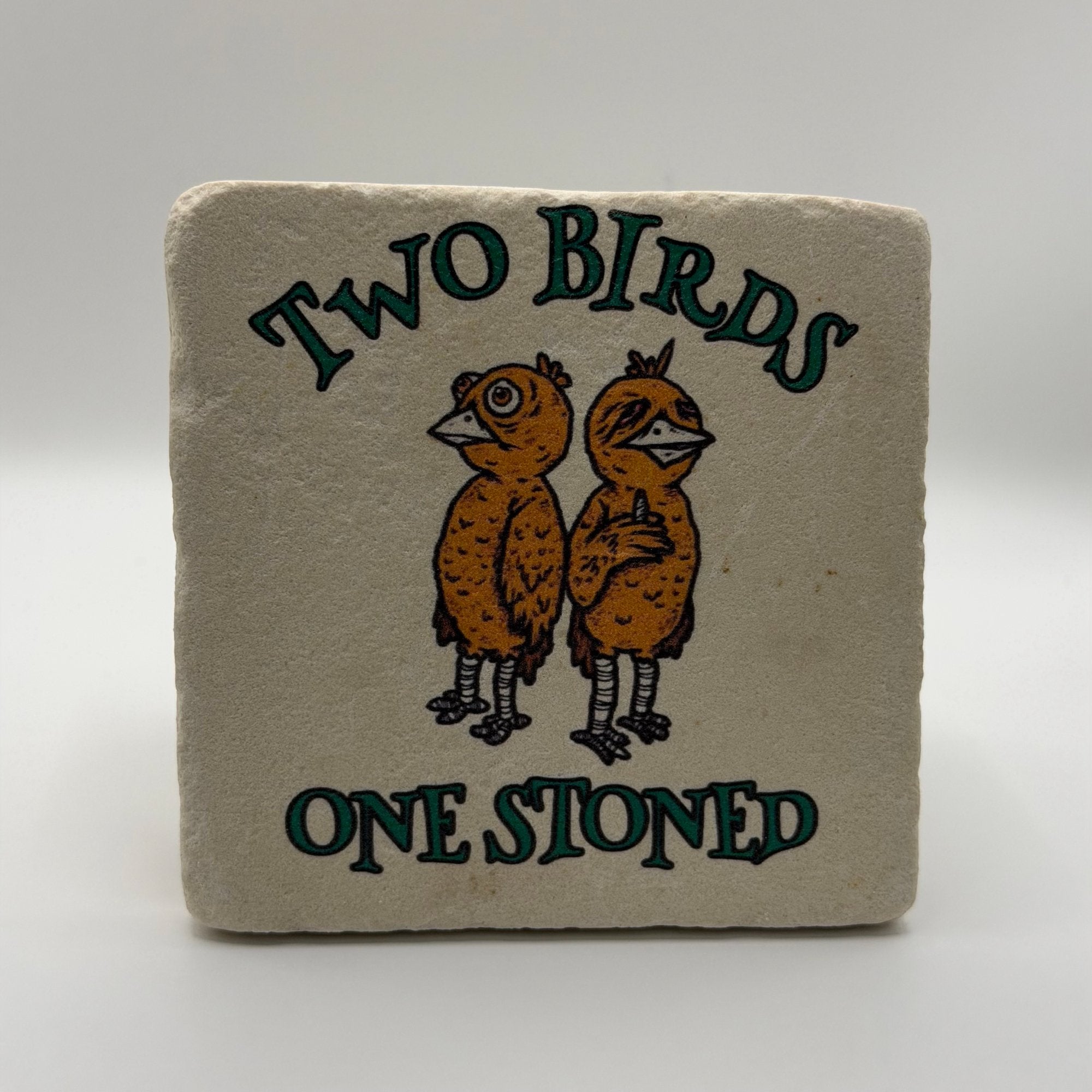 Funny quote 'Two birds one stoned' printed on square travertine stone coaster