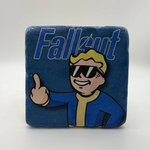 Fallout Vault Boy artwork featuring the middle finger gesture printed on square travertine stone coaster